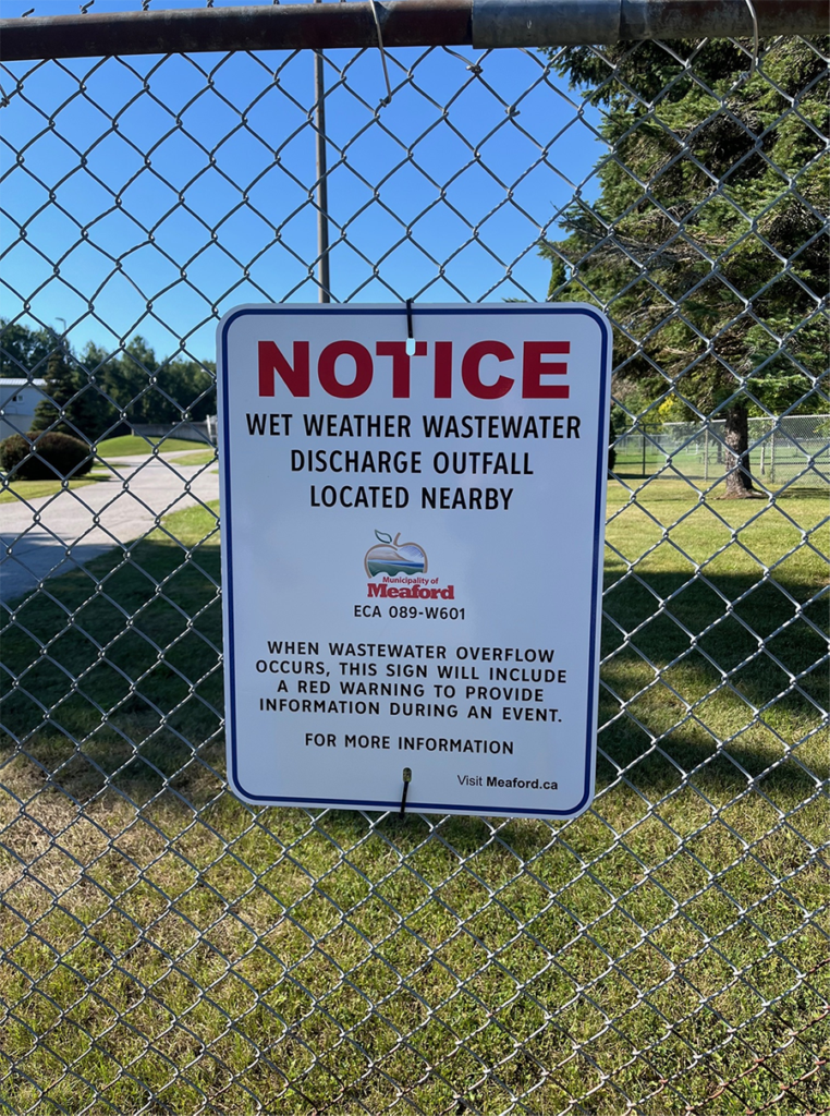 Sign for notice of wet weather wastewater discharge outfall located nearby. Municipality of Meaford ECA 089-W601 When Wastewater overflow occurs, this sign will include a red warning to provide information during an event. For more information visit meaford.ca